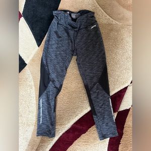 Black striped leggings. Shorter cut